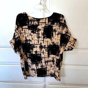 Black/beige polyester top. Size: medium - large. Wash wear- no need to iron